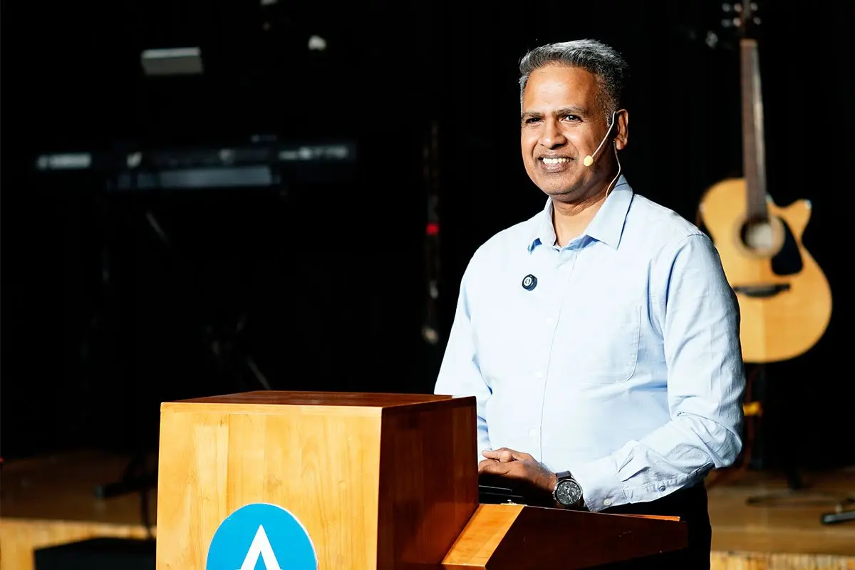 Mathews John preaching at the pulpit during the English service at ALF Kuwait.