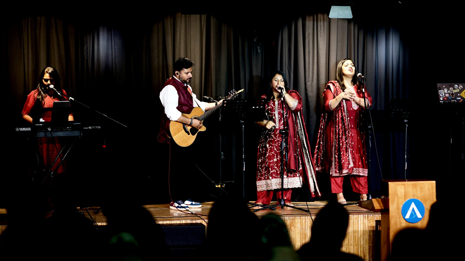 The ALF Kuwait worship team leading a service with guitars, keyboard and singers.